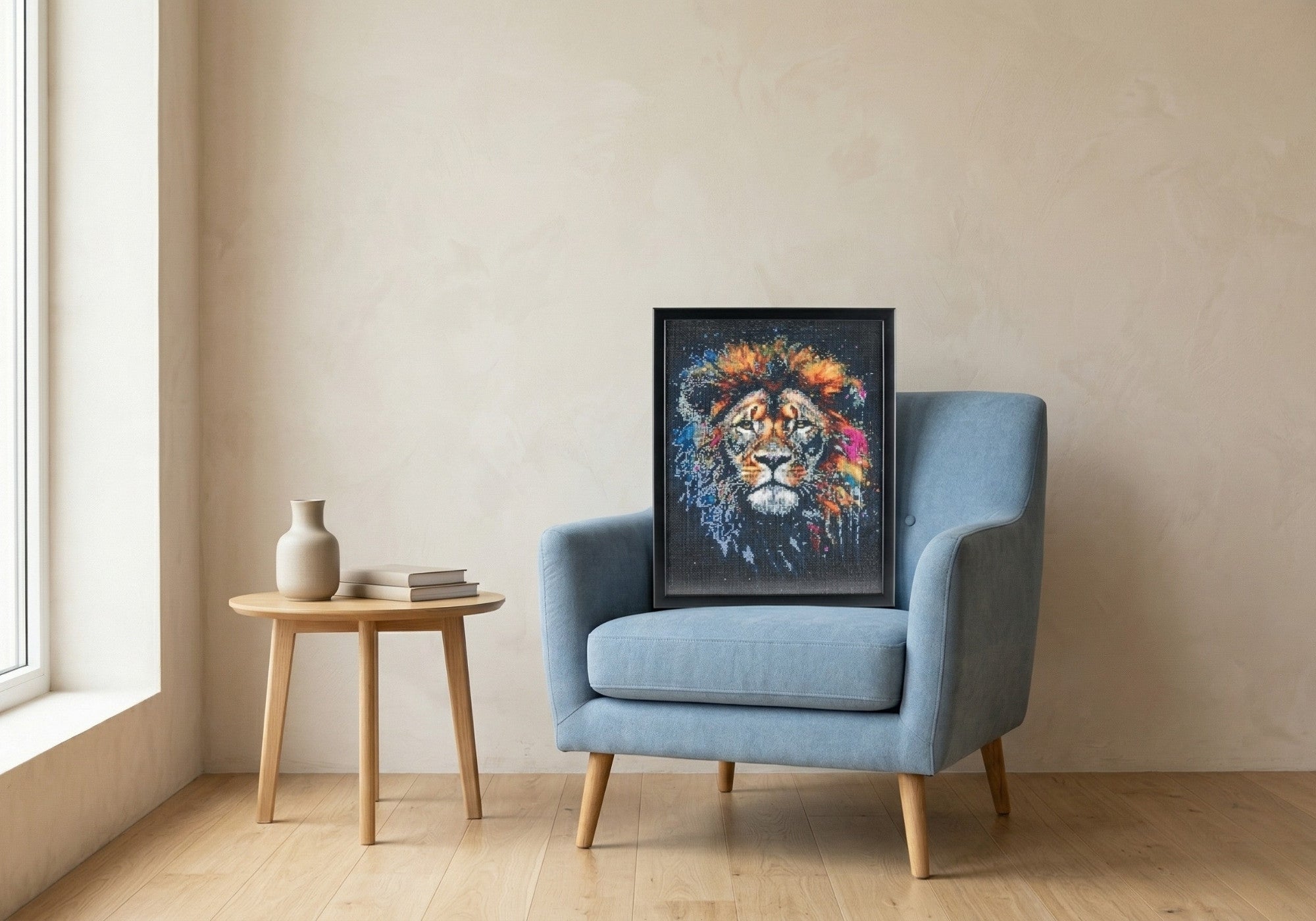 Lion handcrafted cosmic lion crystal micro-mosaic wall art by Lunarti leaning on a blue armchair.