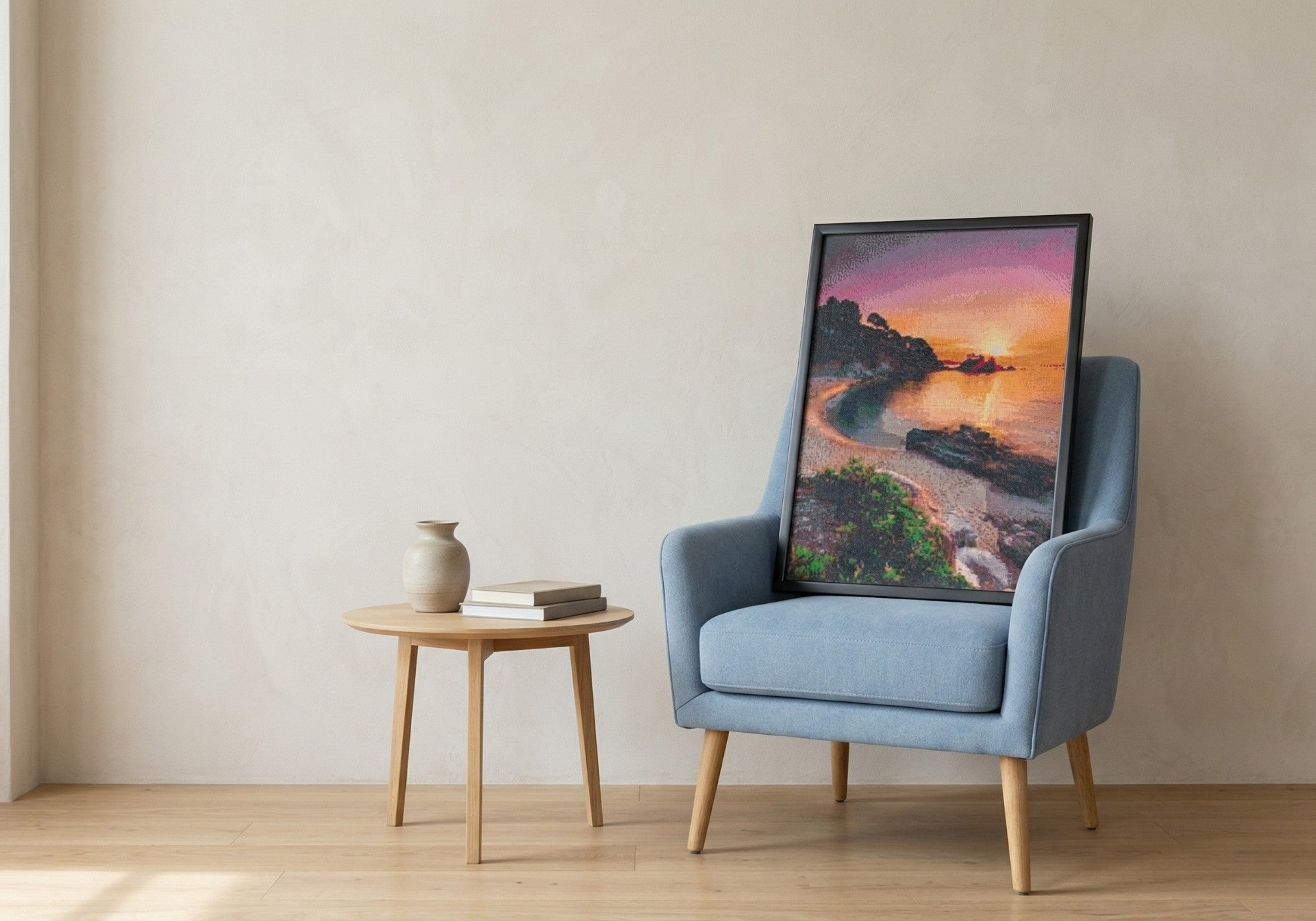 Ocean handcrafted seascape crystal micro-mosaic wall art by Lunarti leaning on a blue armchair.